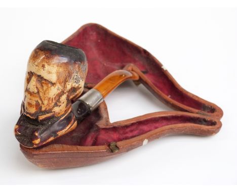 Cased Meerschaum pipe with carved figural decoration, length 15.5cm