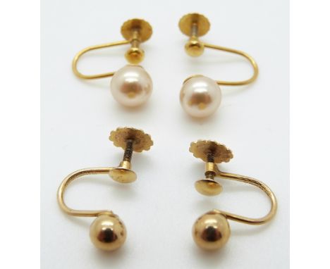 A pair of 9ct gold earrings and a pair of 9ct gold earring by Lotus set with a faux pearl to each, 2.7g