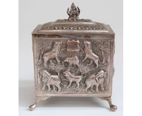 Indian or similar white metal tea caddy with embossed elephant, tiger and other animal decoration, raised on four feet, width