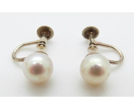 A pair of 9ct white gold earrings set with a pearl to each, in original Garrard & Co box 