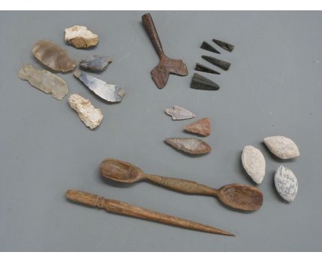 A small collection of archaeological finds to include neolithic flint arrow heads, Roman bone hair pin and spoon and three Ro
