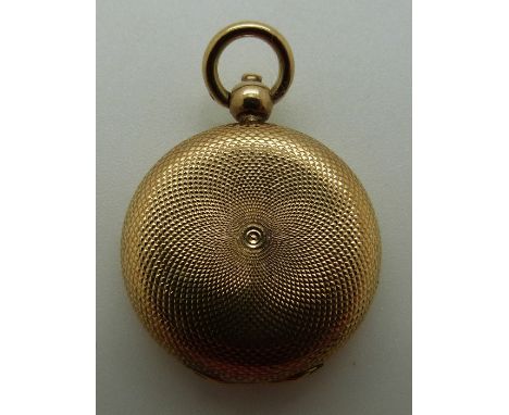 A yellow metal Victorian locket with engine turned decoration, 5.31g