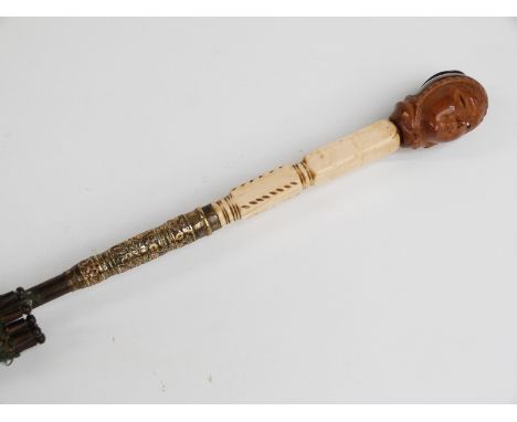 Victorian/Edwardian parasol with intricately carved wooden bust handle, possibly Asian/Oriental, with carved ivory and brass 