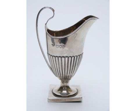 Victorian hallmarked silver helmet shaped cream jug with reeded lower section, London 1892 maker Haseler Brothers, height 12.