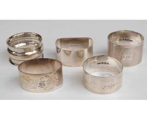 Five various hallmarked silver napkin rings including an engine turned example, weight 126g