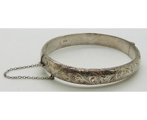 L & Co hallmarked silver bangle with engraved foliate design