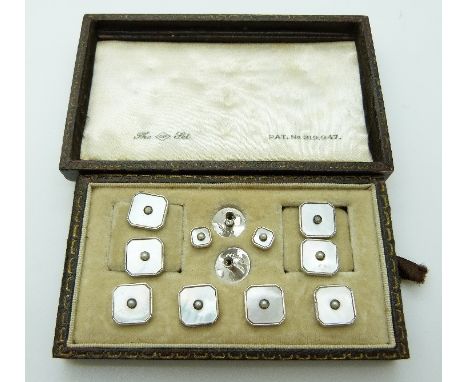 A set of silver studs and cufflinks set with mother of pearl, in original fitted case 
