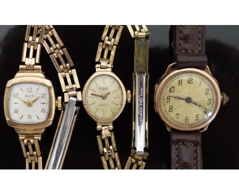 Three 9ct gold ladies wristwatches comprising one Avia, one Everite and one with engine turned face. 