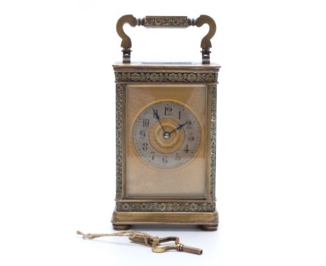 Late 19th / early 20thC brass carriage clock with floral and foliate design to case, Arabic silvered chapter ring, blue steel