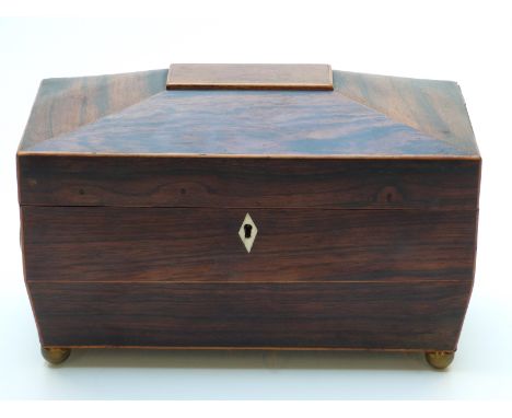 Rosewood twin handled sarcophagus-shaped tea caddy with two compartments flanking mixing bowl, width 30.5cm