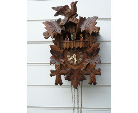 Three train Black Forest German cuckoo clock with musical movement