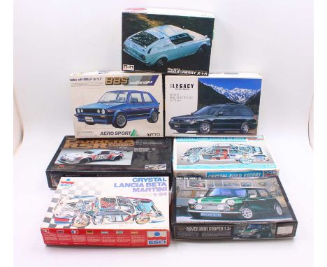 Seven boxed mainly 1/24 scale plastic vehicle kits to include an Esci Crystal Ford Escort RS1800, a Memorial Collections Pors