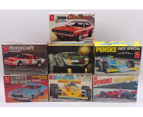A collection of seven boxed AMT/ERTL 1/25 scale Le Mans, Pro Stock and Nascar racing plastic kits to include a Penske Indy Sp