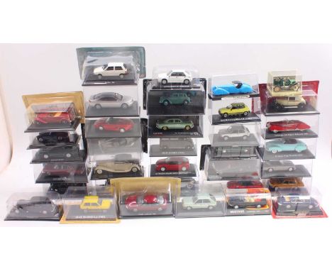 Two trays containing 1/43 scale diecast cars by various manufacturers to include; an ISO Isetta in cream, an Alfa Romeo TZ in