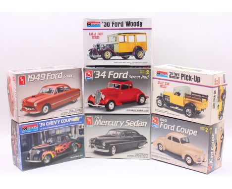 A collection of Monogram and AMT/Ertl 1920s to 1940s plastic car kits to include a Monogram 1930 Ford Woody, a Monogram 1939 