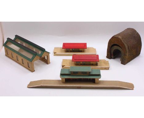Two large trays containing Hornby-Dublo and other makes accessories: pre-war wooden engine shed green roof; two goods depots,