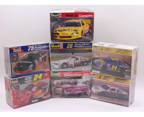 A collection of seven boxed Revell 1/25 scale Pro Stock and Nascar plastic racing car kits to include a Rick Mast Remington T