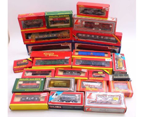 One tray containing 00 gauge coaches and wagons, to include two Bachmann maroon coaches, a Lima GUV, a Hornby CCT wagon, and 