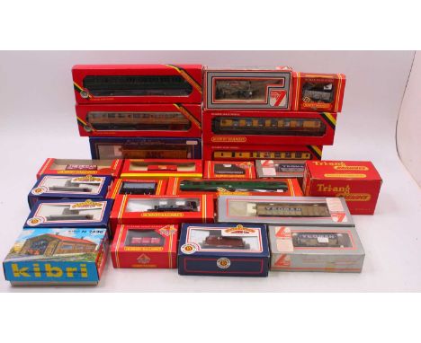 Two trays containing various boxed and unboxed 00 gauge wagons and coaches to include a Bachmann one plank wagon, undecorated