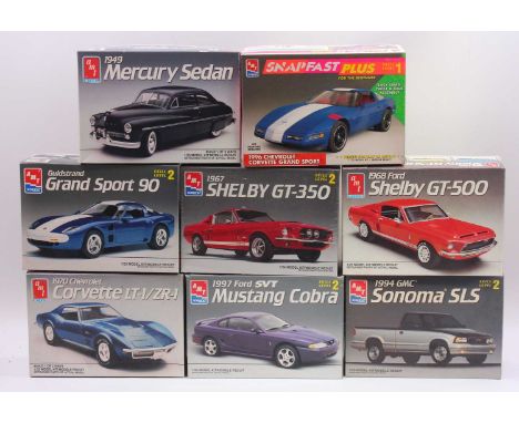 A collection of eight boxed AMT/Ertl 1/25 scale plastic car kits to include a Guldstrand Grand Sport 90, a 1949 Mercury Sedan