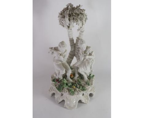 PORCELAIN MODEL OF TWO MUSICIANS RAISED ON A ROCKY BASE