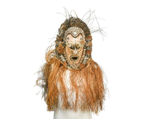 A ceremonial dance mask, probably Sepik River region, Papua New Guinea, 20th century, the painted mask with cowrie shell and 