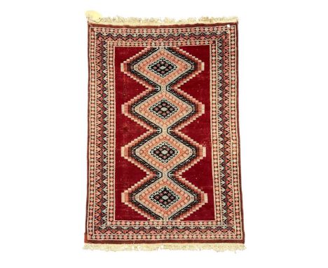 Three vintage rugs; one with aztec style pattern on brown and black ground 198 x 105; a flatweave runner with white chevron b