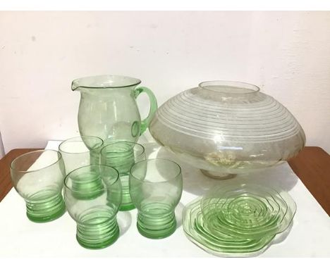 An Art Deco circular white bordered light shade (d.28cm), a set of five Art Deco green glass lemonade glasses complete with j