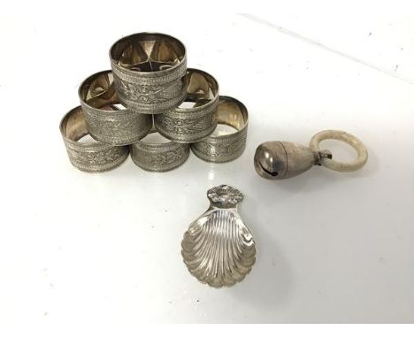 A Birmingham silver caddy spoon with shell motif (8cm x 4cm) (20.82g), an Edwardian teething ring with silver bell and a set 