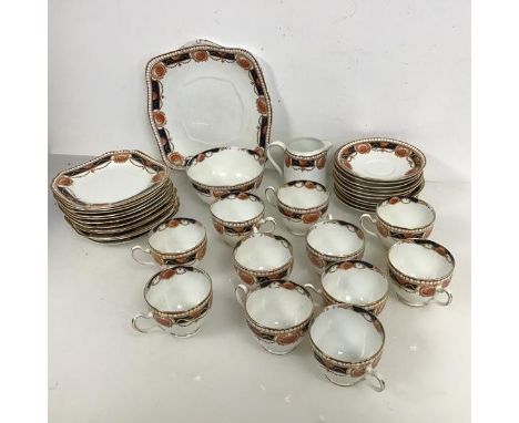 A 1930s Heathcote china tea service including eleven teacups, ten saucers, eleven side plates, a serving plate, a sugar bowl,
