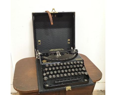 A mid 20thc Remington Compact Portable typewriter, inscribed Assembled by British Labour at the Remington Typewriter Factory,