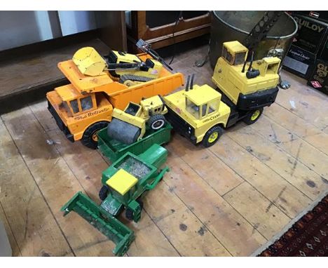 A collection of Tonka metal digger toys including a dump truck (26cm x 46cm x 21cm), bulldozer, crane and a road roller, also