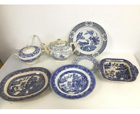 An assortment of 19thc blue and white transfer ware including a Willow pattern bowl, an ashet and serving dish, a Yuan patter