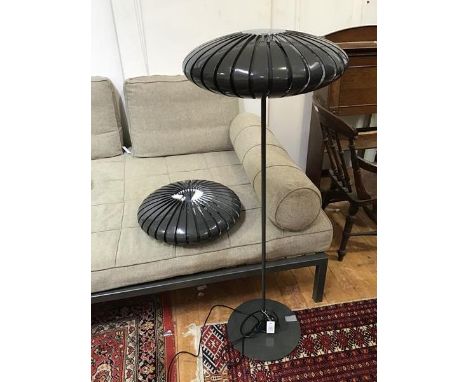 A modern floor lamp with perforated shade in the form of a flattened Chinese lantern, with chromium plated top and plastic di