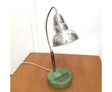 A 1950s desk/table lamp with cast iron green enamelled base, on steel and chromium plated adjustable support, with aluminium 