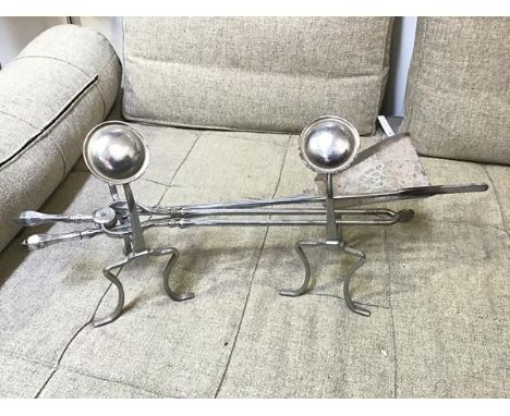 A pair of silvered andirons with circular dished finials, and fire tools including tongs, poker and shovel (poker:70cm) (5)