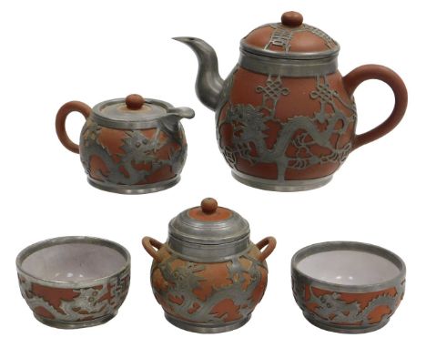 A Chinese pewter mounted Yixing five piece tea set, the pierced mounts dragons and 'long life' symbols, comprising teapot, su