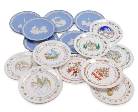 A group of Spode porcelain Christmas plates, Wedgwood blue Jasper commemorative plates, and further plates, all boxed.