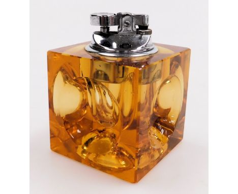 A late 20thC Japanese amber glass cube table lighter, manner of Antonio Imperatore, 7cm wide.