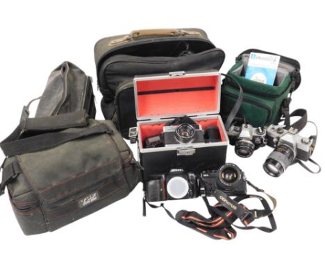 A group of cameras and optical related items, to include an Olympus OM-2 camera, Olympus OM10 camera, Praktica LTL camera, a 