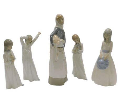 A Lladro porcelain figure of a girl holding a calf, three Nao figures of children in night attire, and a Miquel Requena figur