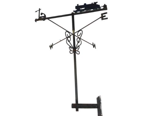 A cast iron weather vane, surmounted with a steam locomotive and signal, 83.5cm high.