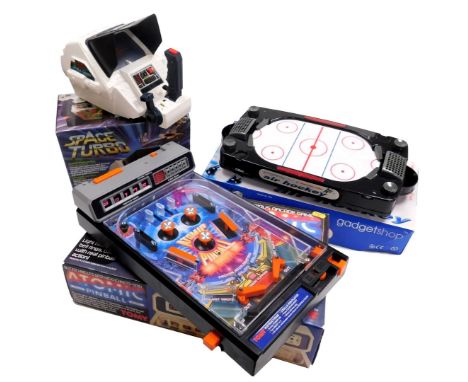 A Tomy Atomic Pinball Arcade action game, Space Tubro ref number 7062, and Gadget Shop air hockey. (3)