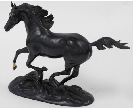 A Franklin Mint porcelain figure modelled as Black Beauty, designed by Pamela du Boulay, 21cm high.