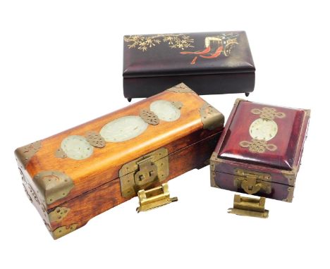 Two hardwood Chinese jewellery boxes, with jade inserts to the lids and fitted interiors, and a Japanese lacquer jewellery bo