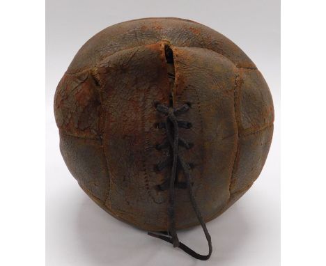 An early 20thC vintage leather football, 20cm wide.
