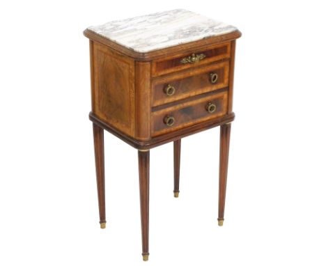 A late 19thC French burr walnut and mahogany commode, with satinwood cross banding, with a white marble top over a frieze dra