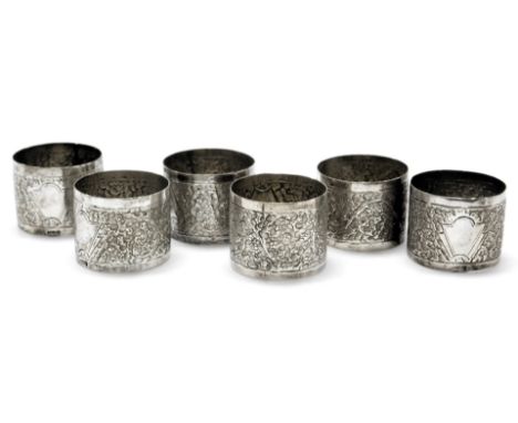 Six early 20thC Anglo Indian napkin rings, with engraved floral decoration, vacant fan shaped reserve, stamped silver, 3.70oz