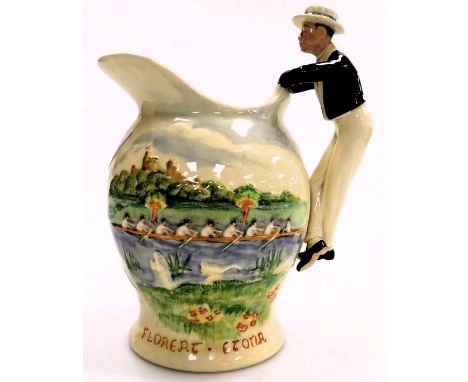 An early 20thC Fieldings Crown Devon pottery musical jug, the Eton Boating Song, 24cm high. (AF)