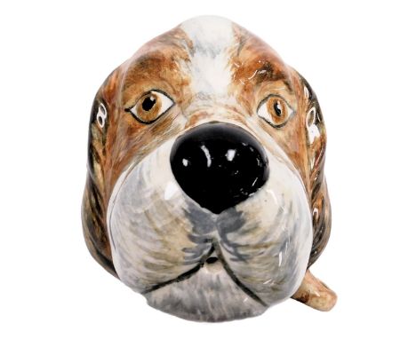 An early 20thC Price Kensington pottery string dispenser, modelled as the head of a dog, printed marks, 11cm wide.